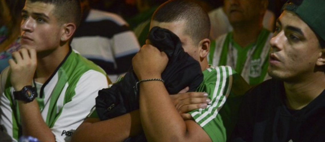 Colombia's  Atletico Nacional supporters reacts during their Copa Sudamericana football final match against Argentina's River Plate in Medellin, Antioquia department, Colombia on December 10, 2014. AFP PHOTO/Raul ARBOLEDA